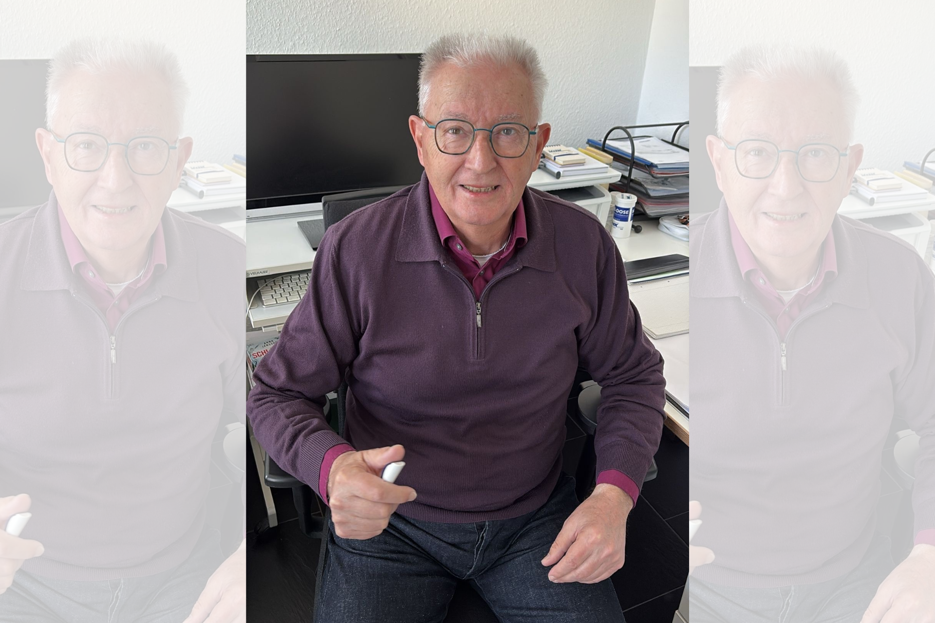 Portr&auml;t von Wilfried Breuer, im Hintergrund ein PC-Arbeitsplatz